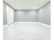 Bright bedroom features sleek, modern flooring and ample closet space at 9200 Lunar Ln, Port Richey, FL 34668