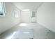 Bright bedroom featuring natural light, marble floors, and neutral white paint at 9200 Lunar Ln, Port Richey, FL 34668