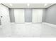 This spacious bedroom features modern flooring and double closets at 9200 Lunar Ln, Port Richey, FL 34668