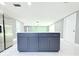 Open concept kitchen with stainless appliances and island with modern finishes at 9200 Lunar Ln, Port Richey, FL 34668