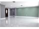 Spacious living room featuring marble floors, recessed lighting, and neutral paint at 9200 Lunar Ln, Port Richey, FL 34668