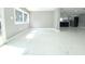 Open concept living area featuring a kitchen, large windows, and marble floors at 9200 Lunar Ln, Port Richey, FL 34668