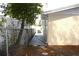 Yard featuring a concrete side path, new fence, and space for a dog run at 9200 Lunar Ln, Port Richey, FL 34668
