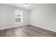 Bedroom featuring a window with blinds and light colored walls and ceiling at 9482 Noddy Tern Rd, Weeki Wachee, FL 34613