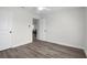 Bedroom with two doorways, light colored walls and ceiling at 9482 Noddy Tern Rd, Weeki Wachee, FL 34613