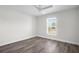Bedroom featuring a window with blinds and light colored walls and ceiling at 9482 Noddy Tern Rd, Weeki Wachee, FL 34613