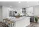 Modern kitchen features stainless steel appliances, white cabinets, and quartz countertops at 9482 Noddy Tern Rd, Weeki Wachee, FL 34613