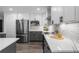 Contemporary kitchen with stainless steel appliances, quartz countertops and white cabinetry at 9482 Noddy Tern Rd, Weeki Wachee, FL 34613
