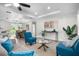 Inviting living space featuring modern decor, hardwood floors, and an open layout to kitchen at 9482 Noddy Tern Rd, Weeki Wachee, FL 34613