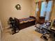 Spare bedroom featuring a trundle bed, exercise equipment, and a side desk at 954 Old Windsor Way, Spring Hill, FL 34609