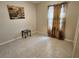 Cozy bedroom with tile flooring, simple decor, and lots of natural light at 954 Old Windsor Way, Spring Hill, FL 34609