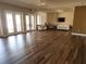 Open clubhouse with hardwood floors, ceiling fans, couches, and french doors at 954 Old Windsor Way, Spring Hill, FL 34609