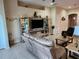 Living area showcasing a mirrored entertainment center, comfortable seating, and decorative wall accents at 954 Old Windsor Way, Spring Hill, FL 34609