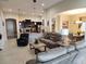 Open floor plan featuring kitchen, living, and dining areas with stylish furnishings and decor at 954 Old Windsor Way, Spring Hill, FL 34609