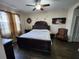 This spacious bedroom has a decorative headboard and complementary furnishings at 954 Old Windsor Way, Spring Hill, FL 34609