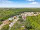 Expansive aerial view of a lovely residential area with mature trees, manicured lawns, and charming homes at 9757 Hermosillo Dr, New Port Richey, FL 34655