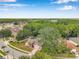 Inviting aerial perspective of a lovely residence boasting attractive landscaping and situated in a serene community at 9757 Hermosillo Dr, New Port Richey, FL 34655