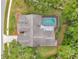 Overhead shot highlighting backyard pool, and roof features at 9757 Hermosillo Dr, New Port Richey, FL 34655