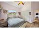 Comfortable bedroom features a ceiling fan, closet, and bedside tables at 9757 Hermosillo Dr, New Port Richey, FL 34655