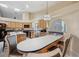 Spacious kitchen with a breakfast bar, modern appliances, and large windows at 9757 Hermosillo Dr, New Port Richey, FL 34655