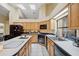 Well-lit kitchen with stainless steel appliances and white countertops at 9757 Hermosillo Dr, New Port Richey, FL 34655