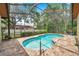 Screened in pool with brick patio at 9757 Hermosillo Dr, New Port Richey, FL 34655