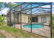 Screened-in pool with patio at 9757 Hermosillo Dr, New Port Richey, FL 34655