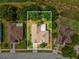 An aerial view of a single-Gathering home with a well-maintained lawn and mature trees in a residential neighborhood at 2255 Long View Cir, Brooksville, FL 34604