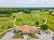 The country club offers a golf course and clubhouse surrounded by lush greenery and clear pathways for a great experience at 2255 Long View Cir, Brooksville, FL 34604