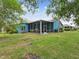Beautiful home with a screened patio, surrounded by mature landscaping, offering privacy and tranquility at 2255 Long View Cir, Brooksville, FL 34604