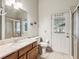 Functional bathroom with a single sink, granite countertops and a door leading to the outdoor area at 2255 Long View Cir, Brooksville, FL 34604
