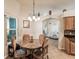 Cozy breakfast nook with a round table, four chairs, and view into the living room at 2255 Long View Cir, Brooksville, FL 34604