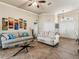 Cozy living area features neutral tones, a glass coffee table, and stylish decor accents at 2255 Long View Cir, Brooksville, FL 34604