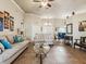 Open-concept living room with tile flooring, neutral paint, and comfortable seating arrangement at 2255 Long View Cir, Brooksville, FL 34604