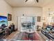 Cozy living room with a ceiling fan, sliding glass doors, and access to outdoor seating at 2255 Long View Cir, Brooksville, FL 34604