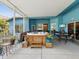 Inviting screened patio boasts a hot tub, outdoor seating, and access to both home and backyard at 2255 Long View Cir, Brooksville, FL 34604