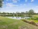 Picturesque pond with clear reflections of the trees, creating a peaceful and natural ambiance at 2255 Long View Cir, Brooksville, FL 34604