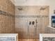 Luxurious walk-in shower with dual shower heads and stylish tile design offers a spa-like experience at 2255 Long View Cir, Brooksville, FL 34604