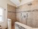 Luxurious walk-in shower with dual shower heads and stylish tile design offers a spa-like experience at 2255 Long View Cir, Brooksville, FL 34604