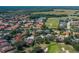 Aerial view of the home next to the golf course showcasing the backyard landscaping at 10645 Garda Dr, Trinity, FL 34655