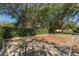 Outdoor basketball court featuring a brick and concrete playing surface and mature trees at 10645 Garda Dr, Trinity, FL 34655