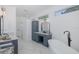 Modern bathroom with a freestanding tub, dual vanities, and stylish fixtures at 10645 Garda Dr, Trinity, FL 34655
