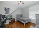 Comfortable bedroom with wood floors and modern decor, perfect for relaxing or studying at 10645 Garda Dr, Trinity, FL 34655