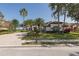 Stately home featuring manicured landscaping, mature trees and a paver driveway at 10645 Garda Dr, Trinity, FL 34655