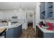 Bright kitchen with a center island, stainless steel appliances, and white countertops at 10645 Garda Dr, Trinity, FL 34655