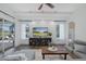Comfortable living room with outdoor access, shiplap wall, large TV, and modern sectional at 10645 Garda Dr, Trinity, FL 34655