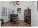 Functional home office with a ceiling fan, wood look floors, and built-in storage at 10645 Garda Dr, Trinity, FL 34655
