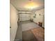 Unfinished basement offering ample storage with a roll-up door for easy access, and versatile space for projects at 11080 Jackdaw Rd, Weeki Wachee, FL 34614