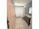 Modern bathroom featuring granite countertops and tile flooring at 11080 Jackdaw Rd, Weeki Wachee, FL 34614