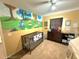 This bedroom features a mural on the wall and carpet at 11080 Jackdaw Rd, Weeki Wachee, FL 34614